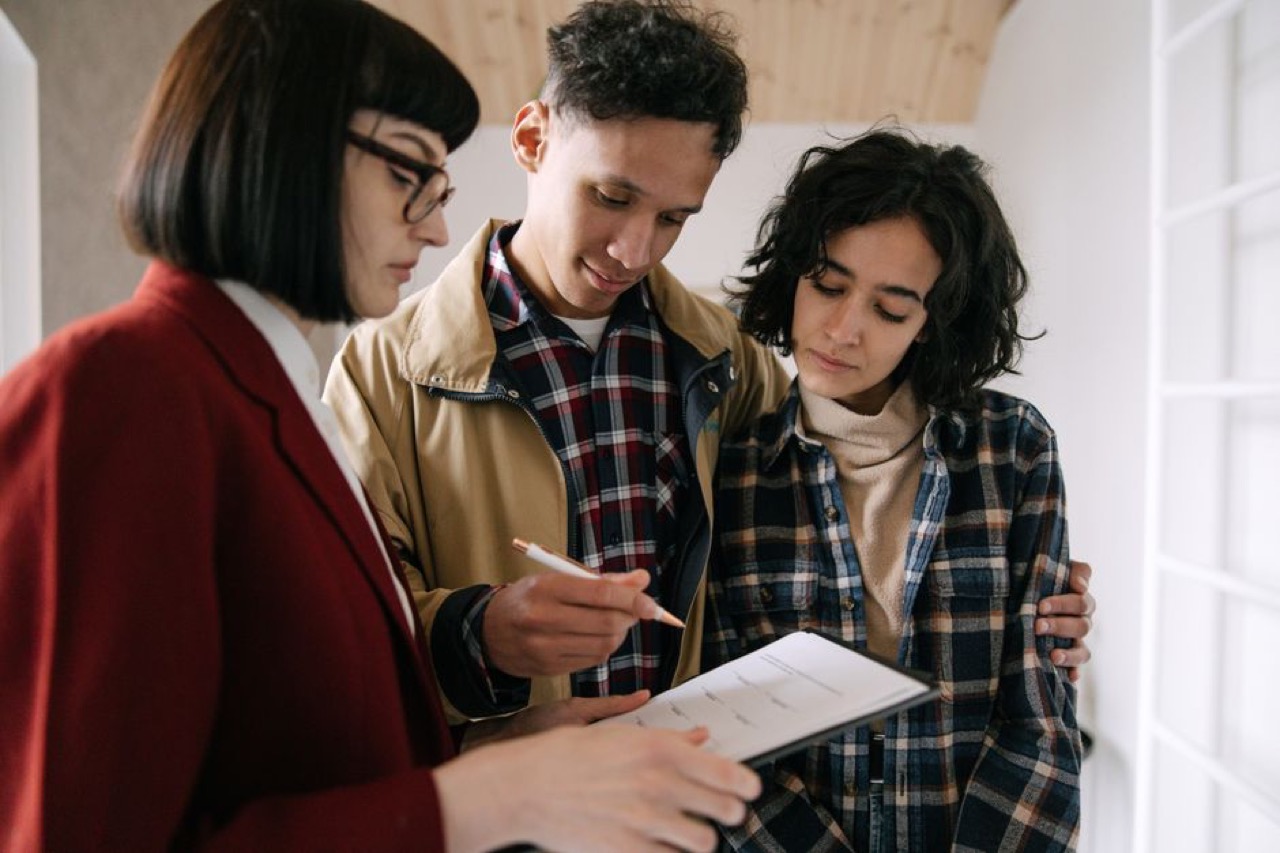 Couple reviewing documents at home - Medical aid for young singles: the best-value plans in 2026