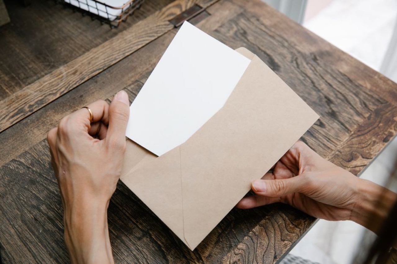 Reading a letter at desk - Letter to add or remove a dependant on your medical aid