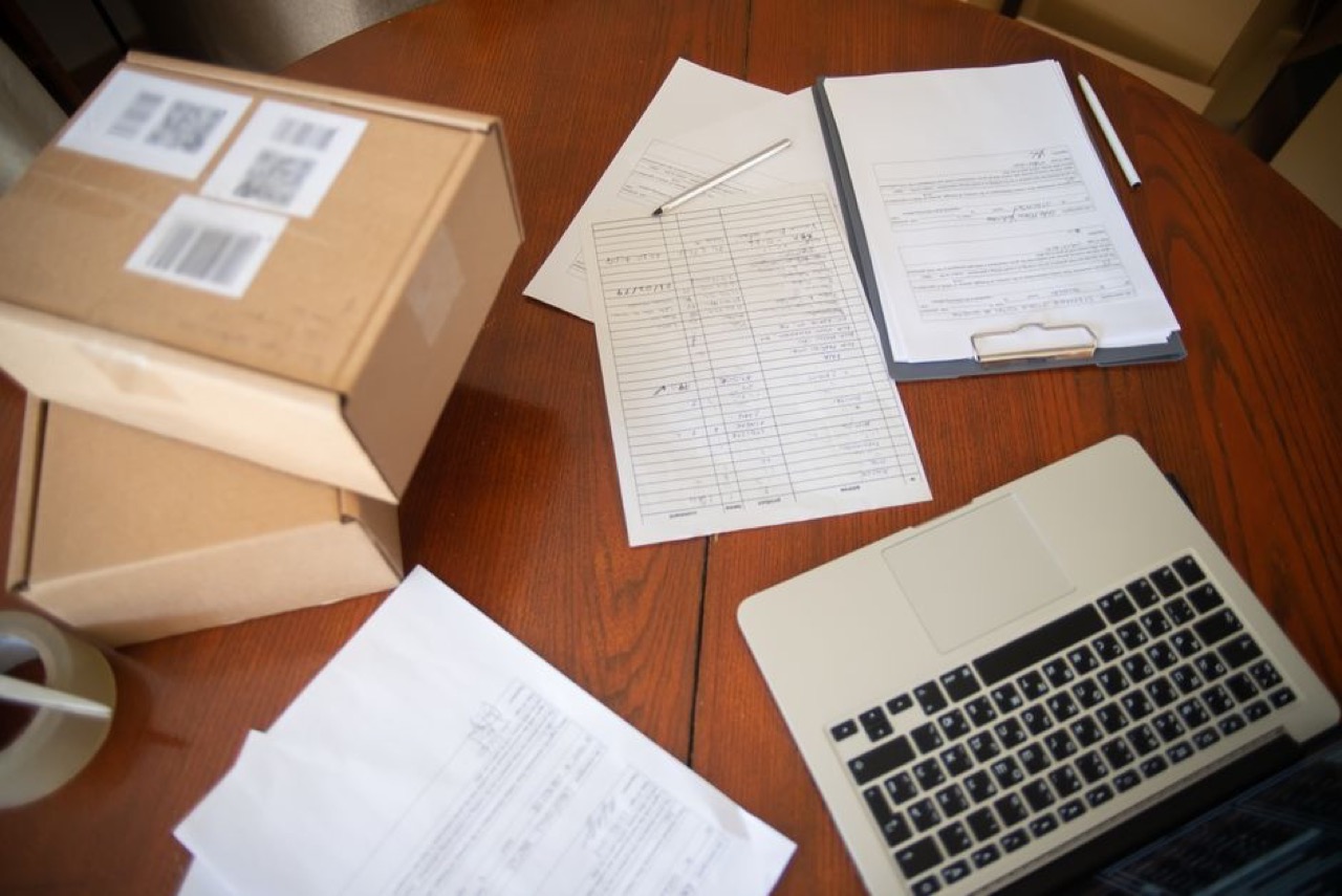 Laptop and paperwork - Medical savings account query and refund letter
